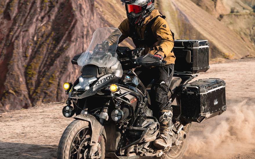 Rider on a loaded adventure bike